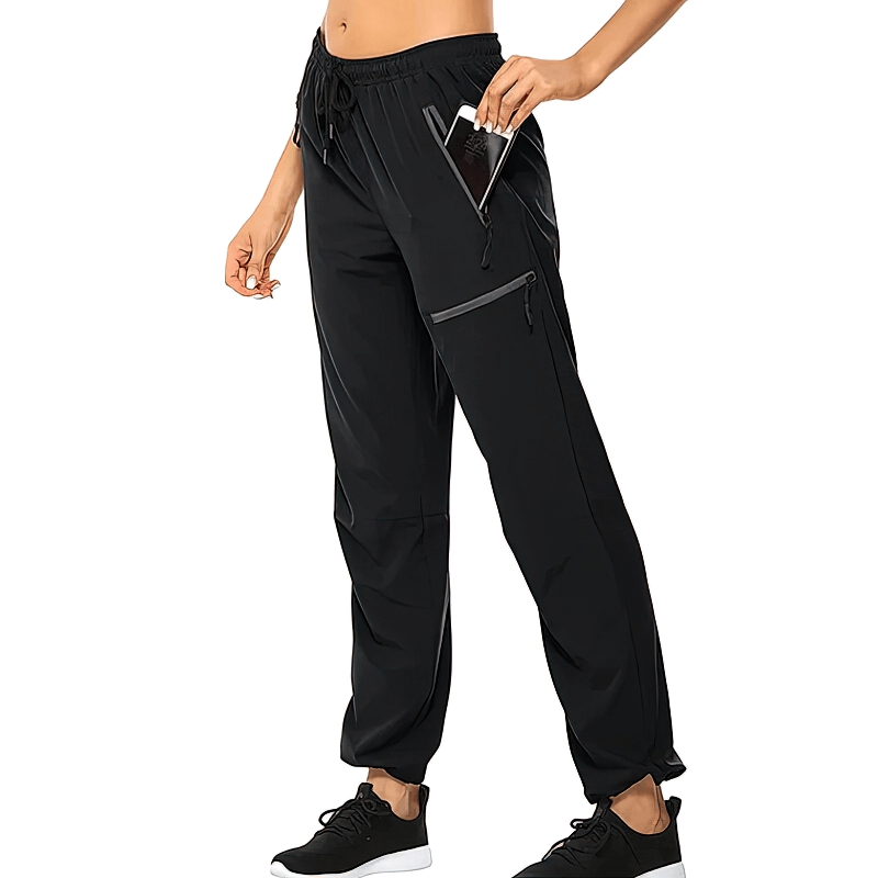 Women's waterproof quick-drying hiking pants with pockets, elastic waist, and 4-way stretch. Perfect for outdoor adventures.